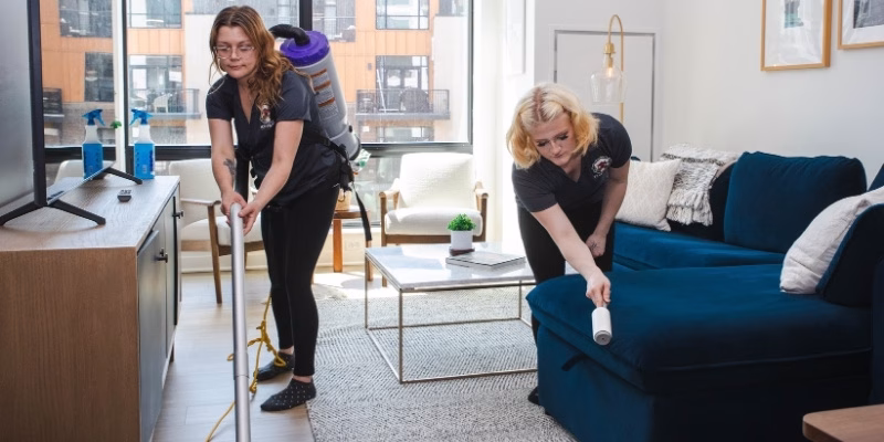 Two Keepsake employees deep cleaning an apartment near Minneapolis, MN