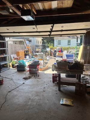 A garage that is in the process of being cleaned and organized by Keepsake PCO